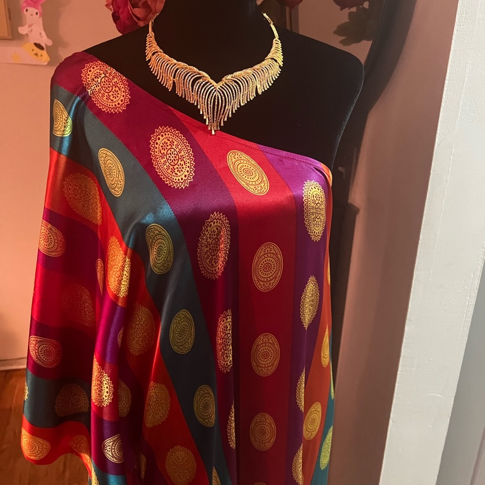 One shoulder silk dress and high split on both sides. Fabric from Dubai